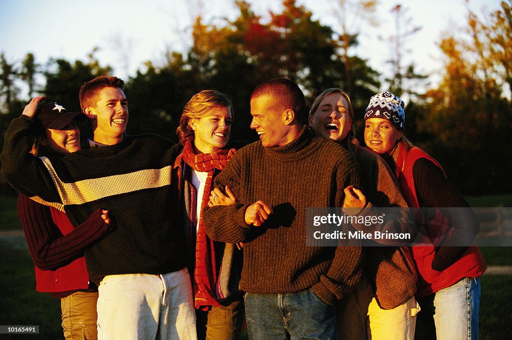 COLLEGE FRIENDS OUTDOORS HAVING FUN