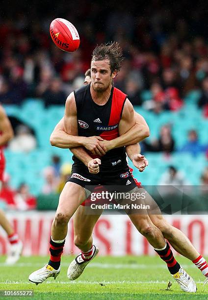 Andrew Welsh of the Bombers is tackled during the round 11 AFL match between the Sydney Swans and the Essendon Bombers at Sydney Cricket Ground on...