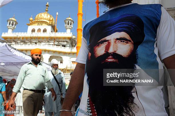 An activist from a radical Sikh wears a T-shirt depicting Sikh leader Sant Jarnail Singh Bhindranwale after prayers at Sri Akal Takht at the Golden...