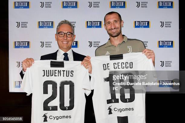 Juventus player Giorgio Chiellini and Francesco Fattori, CEO of De Cecco during the new partnership unveiling at JTC on August 14, 2018 in Turin,...