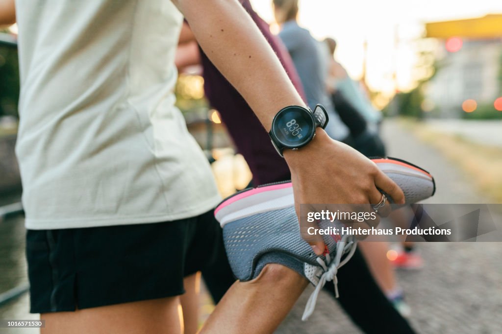 Close Up Of Woman Stretching Before Run
