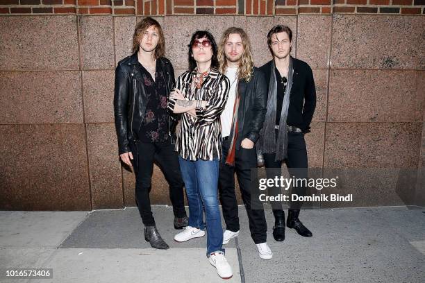 Musicians Jed Elliott, Luke Spiller, Adam Slack and Gethin Davies of the music group The Struts posing on the sidewalk after their visit at Z100...