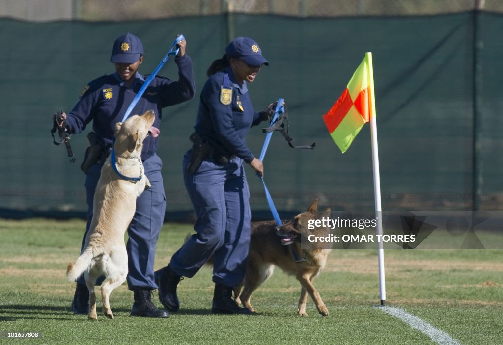 Police officers use trained dogs to chec