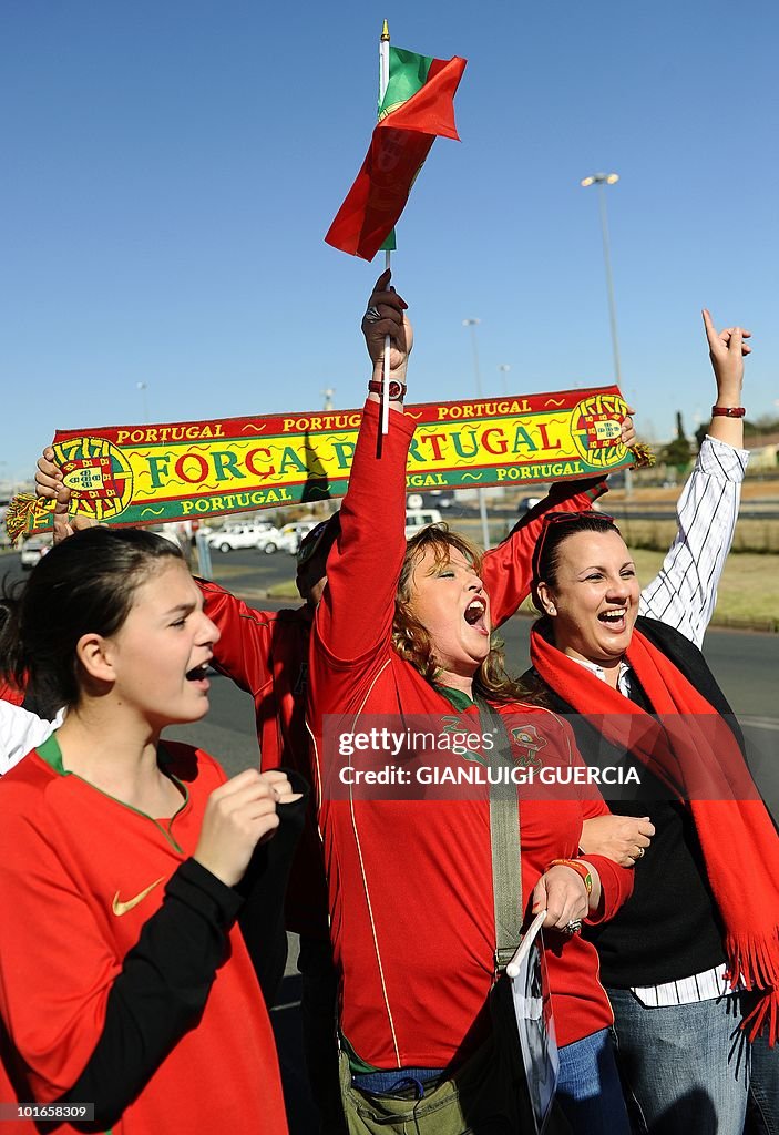 Portuguese fans cheer for their team aft