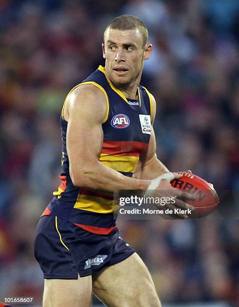 Simon Goodwin of the Crows runs with the ball during the round 11 AFL match between the Adelaide Crows and the Fremantle Dockers at AAMI Stadium on...