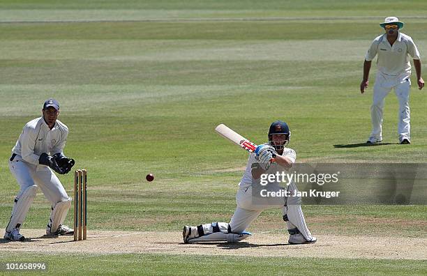 Matthew Walker of Essex plays a sweep shot with Nic Pothas of Hampshire looking on during the LV- County Championship Division One match between...