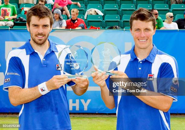 Ken Skupski and Colin Fleming of Great Britain pose with Aegon Trophy after winning the men's doubles final match between Ken Skupski and Colin...