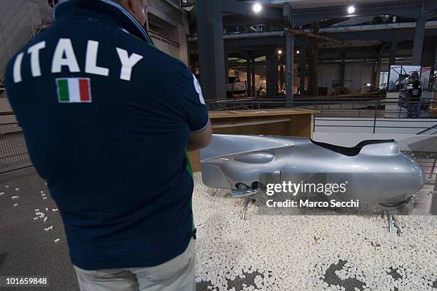 Vespa enthusiast, at the Museo Scienza e Tecnica, admires the historic Vespa Siluro dating 1951 that won the world speed record in the same year on...