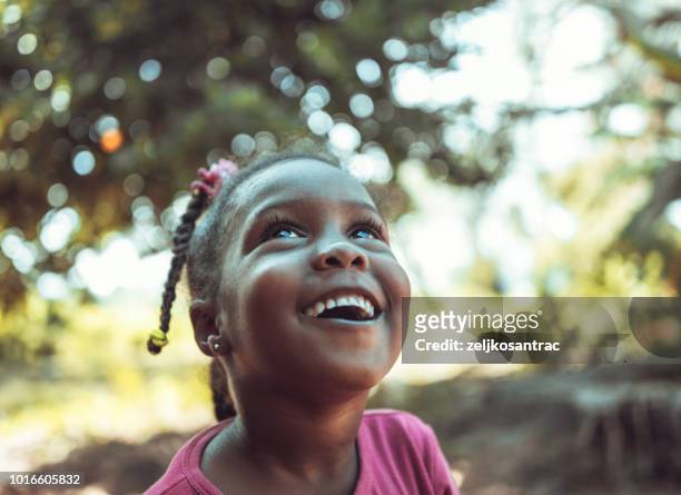 portrait of a cute little african girl - looking up stock pictures, royalty-free photos & images