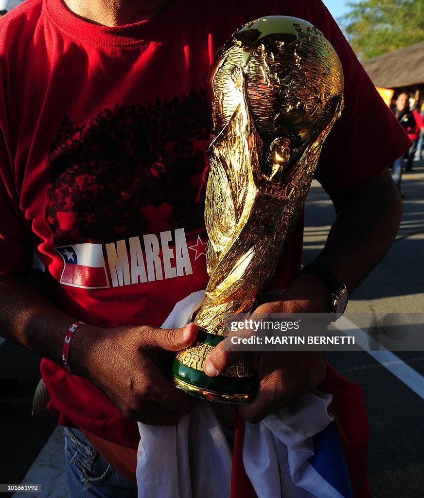 A Chilean supporter holds a fake World C