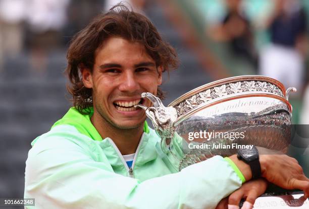 Rafael Nadal of Spain celebrates with the trophy after winning the men's singles final match between Rafael Nadal of Spain and Robin Soderling of...