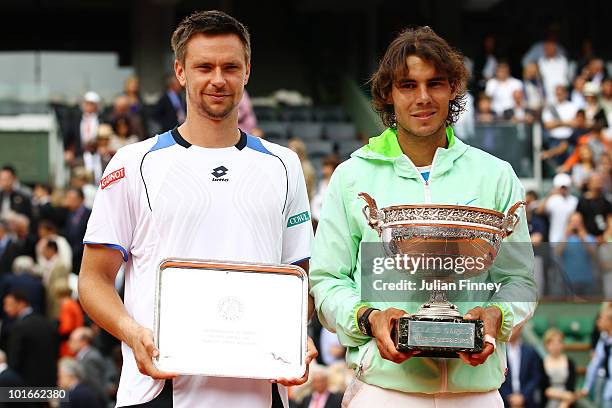 Rafael Nadal of Spain and Robin Soderling of Sweden pose with their trophies after the men's singles final match between Rafael Nadal of Spain and...