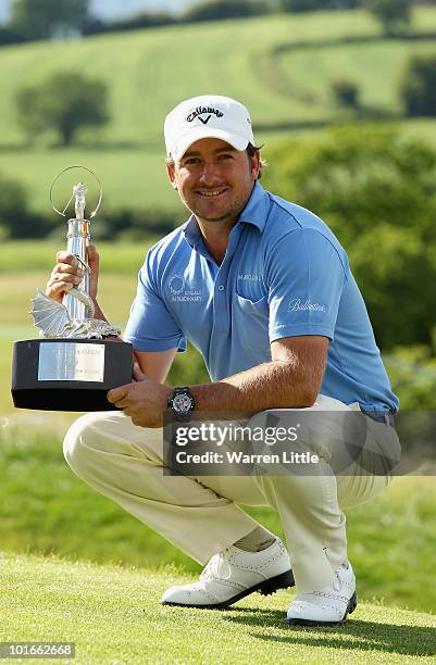 Graeme McDowell of Northern Ireland poses with the trophy after winning the Celtic Manor Wales Open on The Twenty Ten Course on June 6, 2010 in...