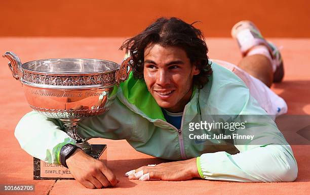 Rafael Nadal of Spain celebrates with the trophy after winning the men's singles final match between Rafael Nadal of Spain and Robin Soderling of...