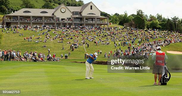 Graeme McDowell of Northern Ireland plays his appraoch shot into the 18th green during the final round of the Celtic Manor Wales Open on The Twenty...