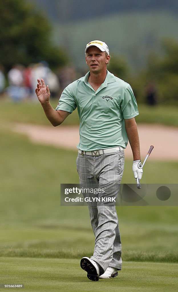 German golfer Marcel Siem walks after hi