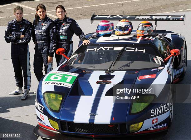 Swiss Rahel Frey, Natacha Gaghnang, and their compatriot Cyndie Allemann pose next to their Ford GT N° 61 on June 6, 2010 in Le Mans, western France...