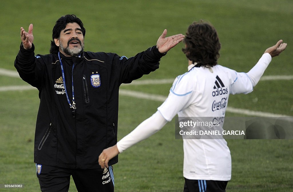 Argentina's coach Diego Maradona (L) ges