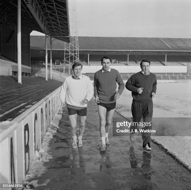 Tottenham Hotspur FC soccer players Alan Mullery, Alan Gilzean , Jimmy Greaves in training, UK, 24th January 1965.