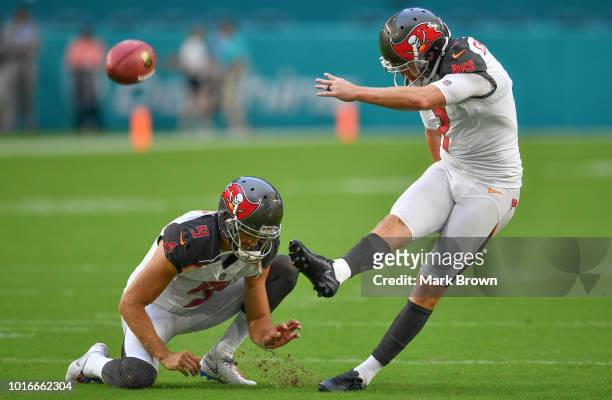 Chandler Catanzaro of the Tampa Bay Buccaneers attempting to make a kick in warm ups before a preseason game against the Miami Dolphins at Hard Rock...