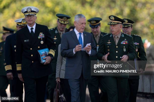 Defense Secretary Jim Mattis speaks with the Commander of Brazil's War College, General Decio Luis Schons , during a visit to the WWII Veteran's...