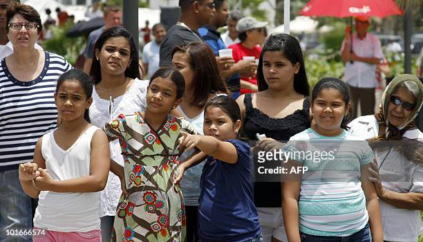 Dominicans look at boats at Don Diego port in Santo Domingo on June 6 during "Santo Domingo Sails 2010". The international event has ships travelling...