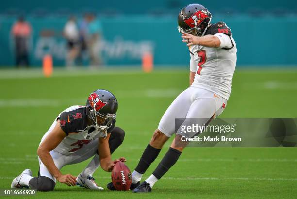 Chandler Catanzaro of the Tampa Bay Buccaneers attempting to make a kick in warm ups before a preseason game against the Miami Dolphins at Hard Rock...