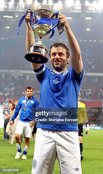 Michael Sheen holds the trophy aloft at Soccer Aid in aid of UNICEF at Old Trafford on June 6, 2010 in Manchester, England.