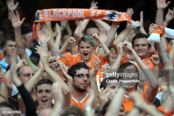 Young Blackpool fan cheers amongst the crowd during the Barclays Premier League match between Arsenal and Blackpool at The Emirates Stadium in London...