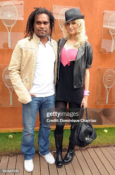 Model Christian Karembeu and Adriana Karembeu are seen at the French Open on June 6, 2010 in Paris, France.