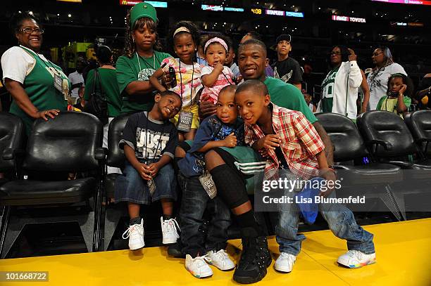 Nate Robinson of the Boston Celtics poses for a photo with his children prior to playing against the Los Angeles Lakers in Game Two of the 2010 NBA...