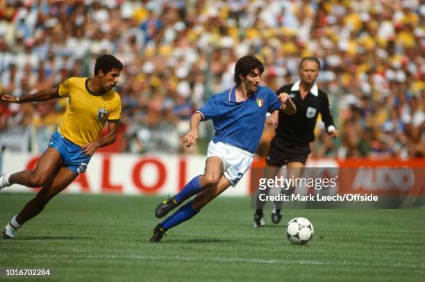 July 1982 - FIFA World Cup - Italy v Brazil - Paolo Rossi of Italy gets away from Toninho Cerezo of Brazil -