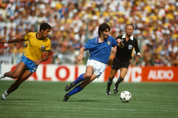July 1982 - FIFA World Cup - Italy v Brazil - Paolo Rossi of Italy gets away from Toninho Cerezo of Brazil -
