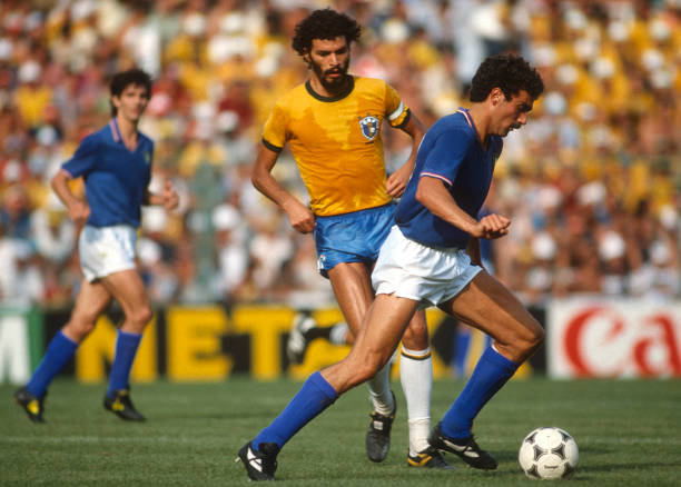 July 1982 - FIFA World Cup - Italy v Brazil - Giuseppe Bergomi of Italy on the ball, watched by Socrates of Brazil -