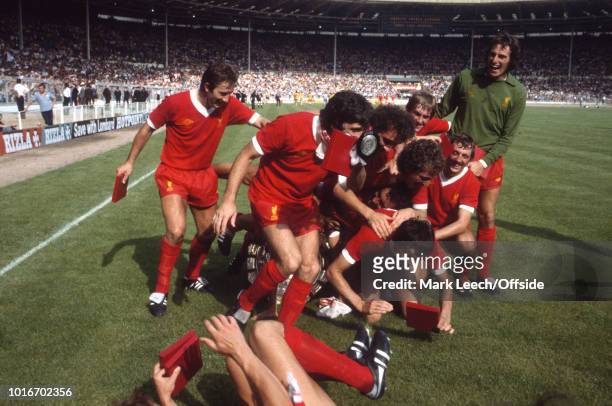 August 1979 Wembley - Football Association Charity Shield - Arsenal v Liverpool - Kenny Dalglish pushes his teammates over as they pose with the...