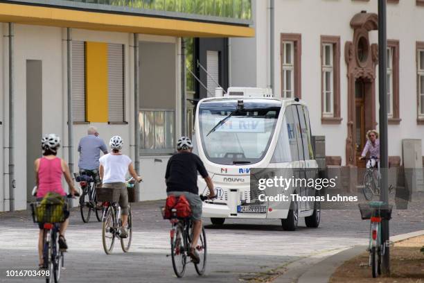 An electric autonomous bus drives on August 14, 2018 in Mainz, Germany. Called EMMA, the bus is made by Navya and will transport passengers for free...