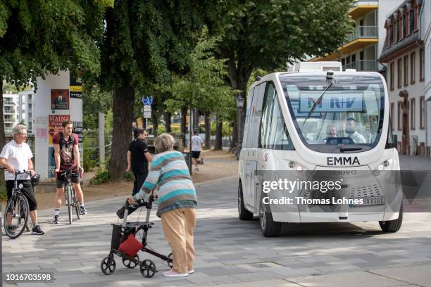 An electric autonomous bus drives on August 14, 2018 in Mainz, Germany. Called EMMA, the bus is made by Navya and will transport passengers for free...