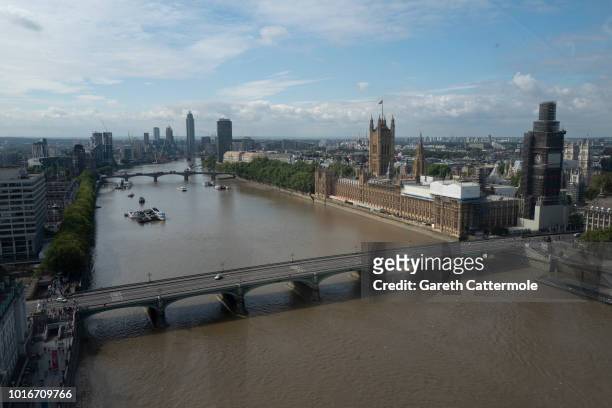 An aerial view as police officers secure Westminster Bridge going towards the Houses of Parliament after a vehicle crashed into security barriers,...