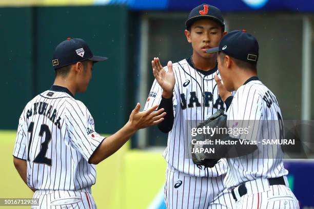 Shinnosuke Kanai, Seiya Fukuhara and Haruto Uchiyama of Japan celebrate during the WBSC U-15 World Cup Group B match between Australia and Japan at...