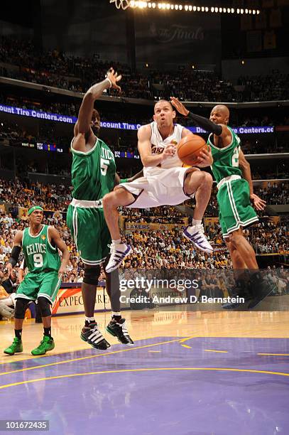 Jordan Farmar of the Los Angeles Lakers goes up for a shot between Kevin Garnett and Ray Allen of the Boston Celtics in Game Two of the 2010 NBA...