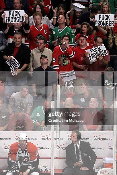 Chris Pronger of the Philadelphia Flyers sits on the bench beneath signs held by fans of the Chicago Blackhawks in Game Five of the 2010 NHL Stanley...