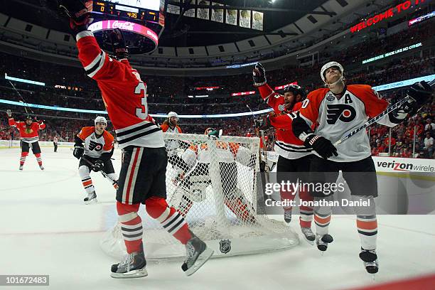 Chris Pronger of the Philadelphia Flyers reacts as Dave Bolland of the Chicago Blackhawks celebrates after scoring his team's second goal in the...