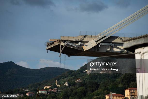 The remains of the Morandi motorway bridge stands after it partially collapsed in Genoa, Italy, on Tuesday, Aug. 14, 2018. The bridge on the main...