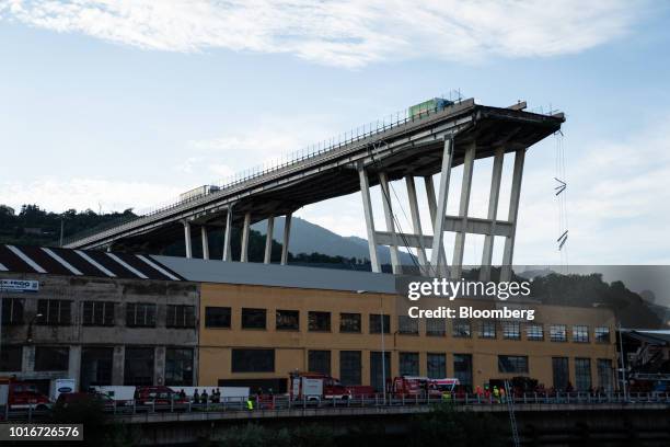 The remains of the Morandi motorway bridge stands after it partially collapsed in Genoa, Italy, on Tuesday, Aug. 14, 2018. The bridge on the main...