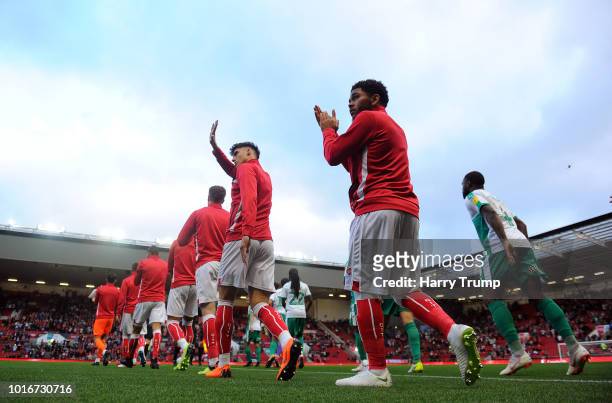 Members of both sides make their way out for the start during the Carabao Cup First Round match between Bristol City and Plymouth Argyle at Ashton...