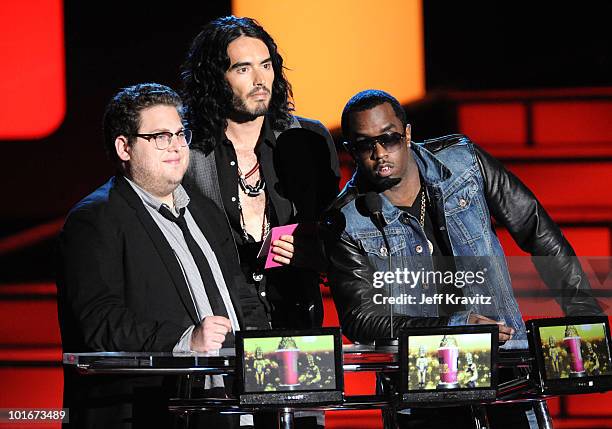 Jonah Hill, Russell Brand and Sean "Diddy" Combs speak onstage at the 2010 MTV Movie Awards at Gibson Amphitheatre on June 6, 2010 in Universal City,...
