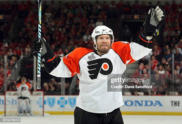 Kimmo Timonen of the Philadelphia Flyers celebrates a goal scored by teammate James van Riemsdyk during the third period of Game Five of the 2010 NHL...