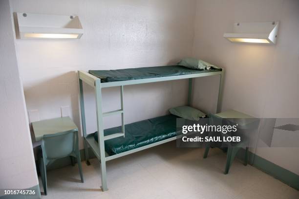 Bunk bed and desks inside a cell is seen at the Caroline Detention Facility in Bowling Green, Virginia, on August 13, 2018. - A former regional jail,...