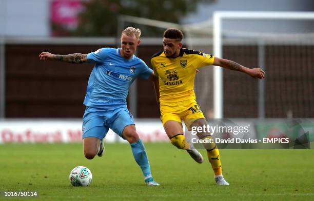 Coventry City's Jack Grimmer and Oxford United's Marcus Browne battle for the ball Oxford United v Coventry City - Carabao Cup - First Round - Kassam...