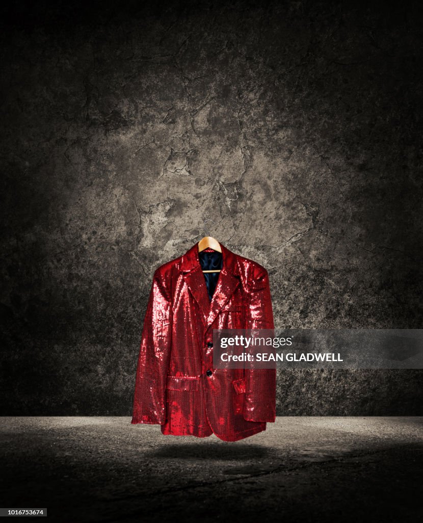 Floating red sequin cabaret jacket on hanger